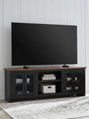 Wildenauer - XL TV Stand With Fireplace Option - Brown / Black